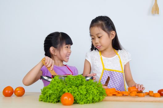 kids having fun with cooking. Healthy eating concept.