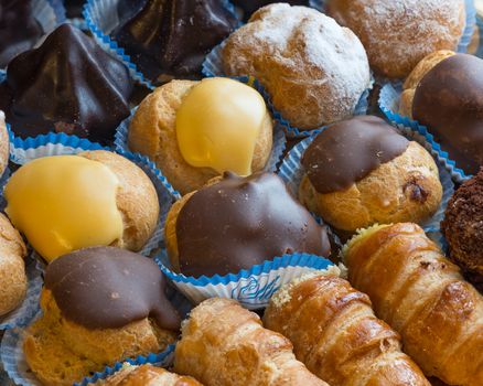 In the pictured colorful pastries with candied,cream and chocolate from above,the real Italian confectionery.