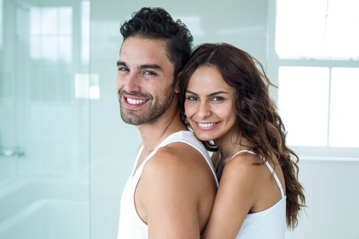 Side view portrait of happy romantic couple at home