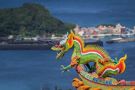 Dragon sculpture on roof of a Chinese temple.