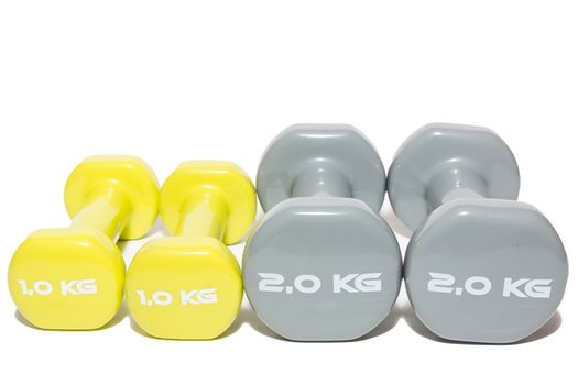 The photo shows a dumbbell on a white background