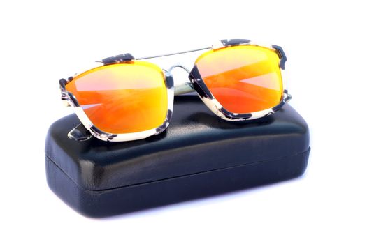 Image of sunglasses and black box on a white background