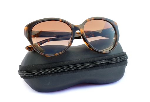 Image of sunglasses and black box on a white background