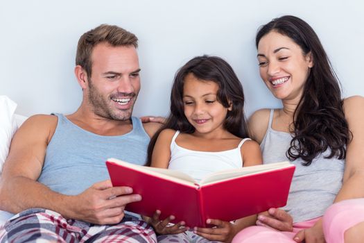 Happy family in their bedroom at home