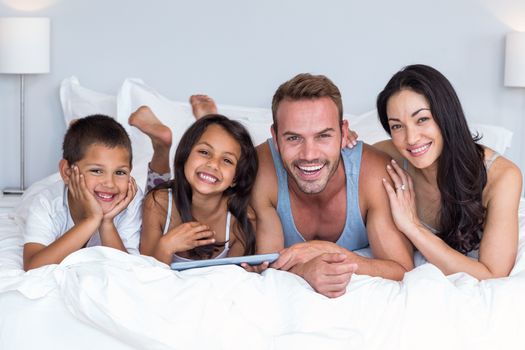 Happy family in their bedroom at home