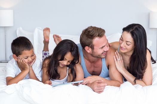 Happy family in their bedroom at home