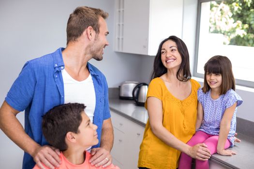 Happy family in the kitchen at home