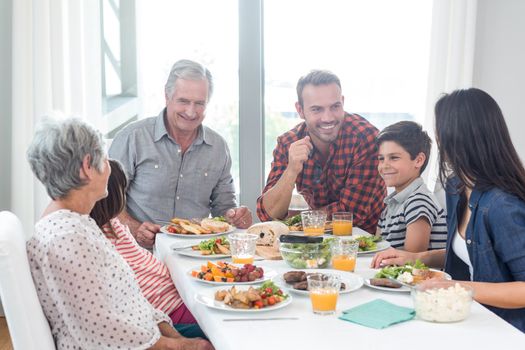 Happy family having breakfast in the morning