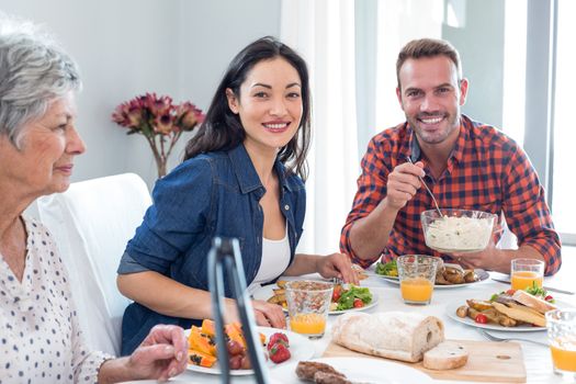 Happy family having breakfast in the morning