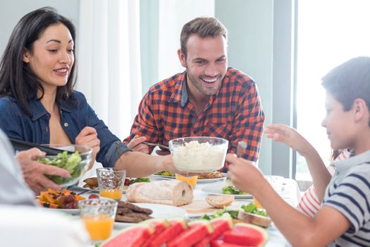 Happy family having breakfast in the morning