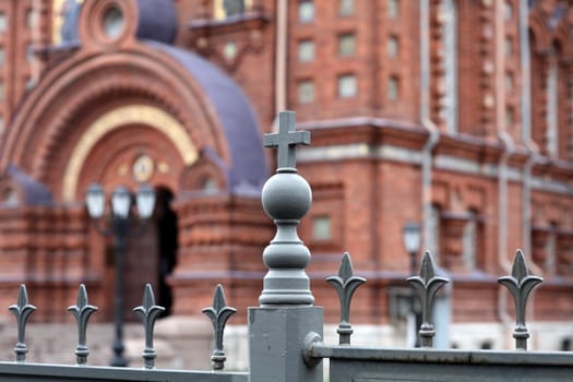 metallic fence decoration with cross  on background of the church