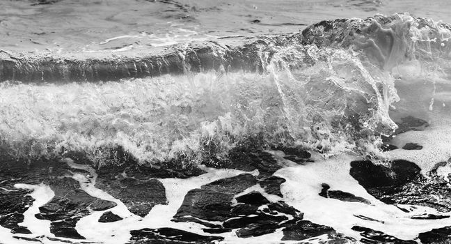 Black and white Beach rock and blue sea in Thailand