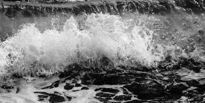 Black and white Beach rock and blue sea in Thailand