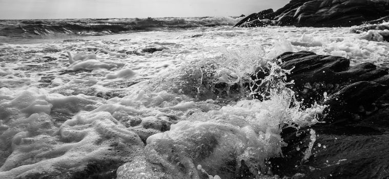 Black and white Beach rock and blue sea in Thailand