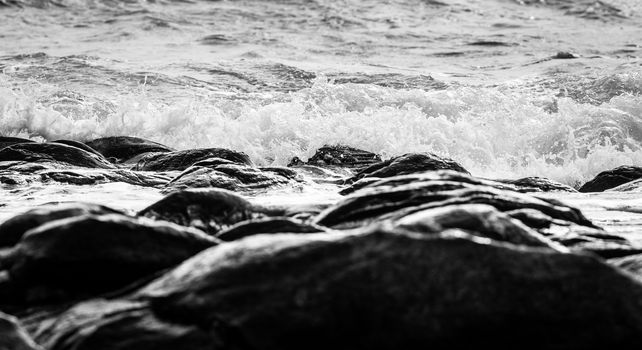 Black and white Beach rock and blue sea in Thailand