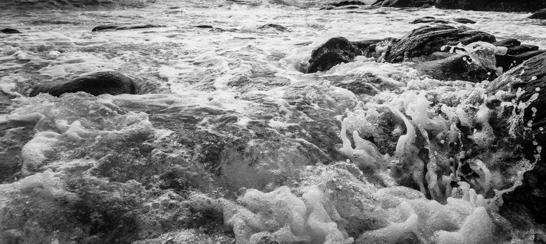 Black and white Beach rock and blue sea in Thailand