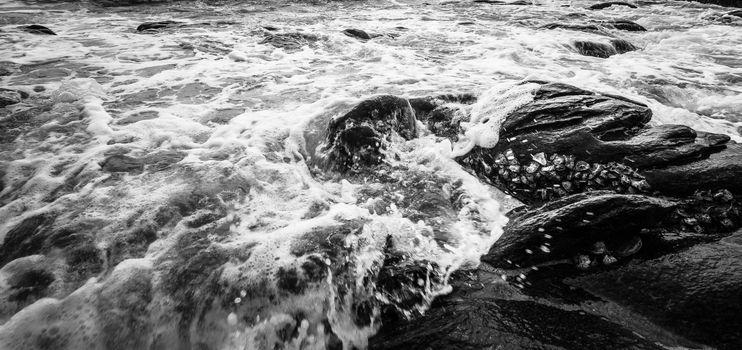 Black and white Beach rock and blue sea in Thailand