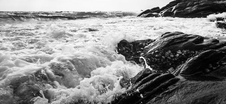 Black and white Beach rock and blue sea in Thailand