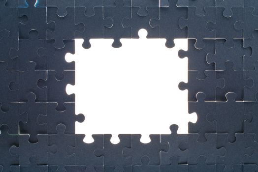 Grey puzzle background with big empty white space, close up view