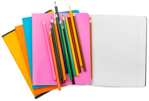 Set of notebooks with crayons on isolated white background, closeup