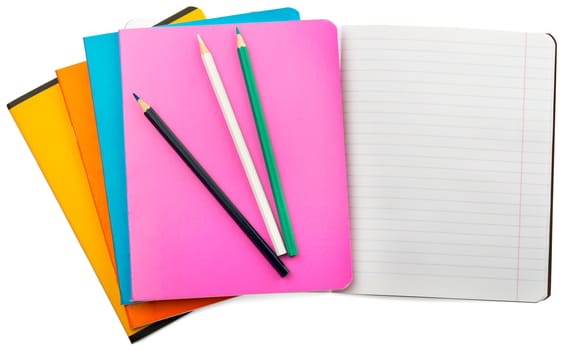 Set of notebooks with colorful crayons on isolated white background, closeup