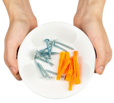 Female hands holding plate with screws on isolated white background