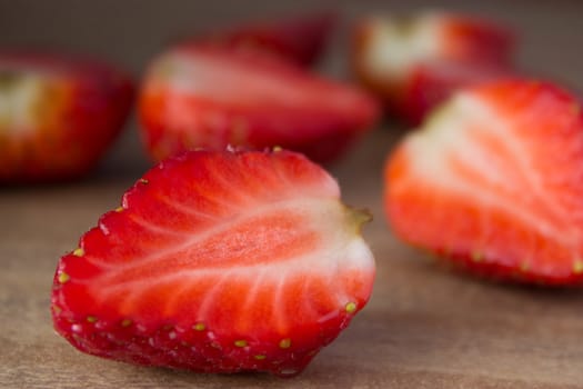 red ripe  fresh strawberries on wooden table