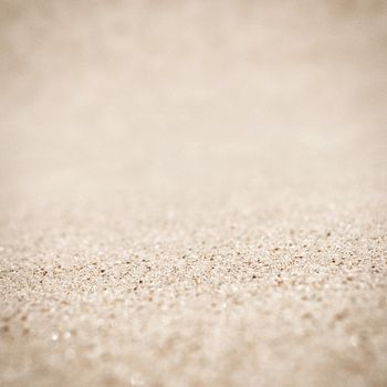 Sand on the beach background, tilt-shift technique