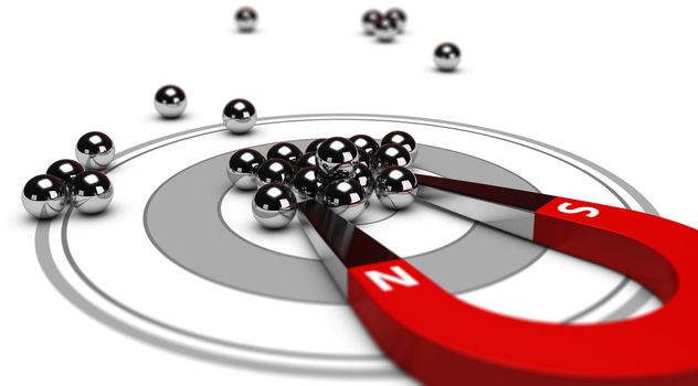 Horseshoe magnet attracting metal balls in the center of a grey target. Image concept of inbound marketing or advertising.