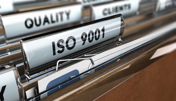 Close up on a file tab with the word ISO 9001, focus on the main text and blur effect. Concept image for illustration of Quality Standards