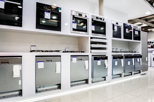 Gas and electric ovens and other home related appliance or equipment in the retail store showroom