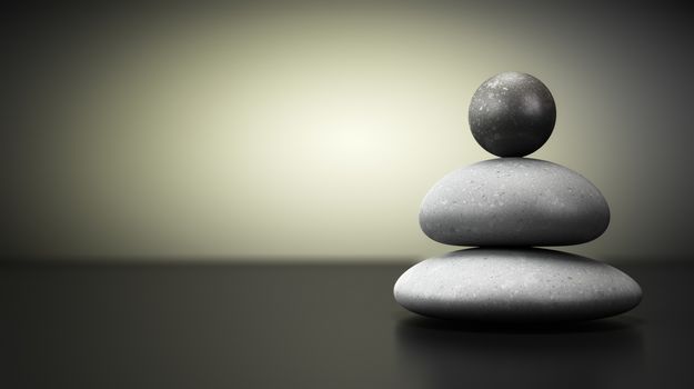 Three pebbles stack over beige and black background, balance stones with room for text on the left. concept image symbol of stability.