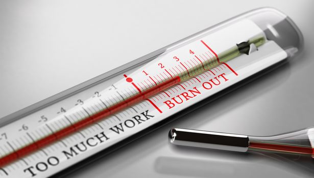 Thermometer with the text burn out and too much work over grey background. Concept image for illustration of occupational burn-out or job stress.