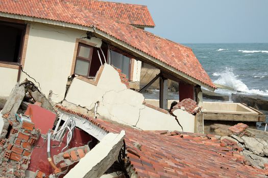 Erosion at seaside resort from climate change situation, wave broken building, very unsafe, danger, environment risk of worldwide when sea level rise by warming, scene at Cua Dai, Hoi An, Vietnam
