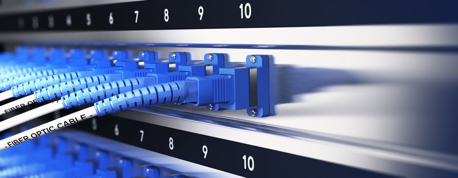 Close up of optical fiber optic telecommunication equipment and patchcords inside a network infrastructure. Blur effect with focus on one cable, blue tones.