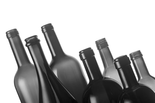 Collection of eight different types of wine bottles isolated on white background