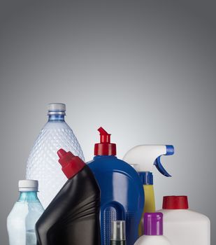 Set of plastic containers isolated on grey background, ready for recycle