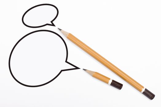 Horizontal top view of two yellow pencils speech bubbles of different sizes above them isolated on white background. 