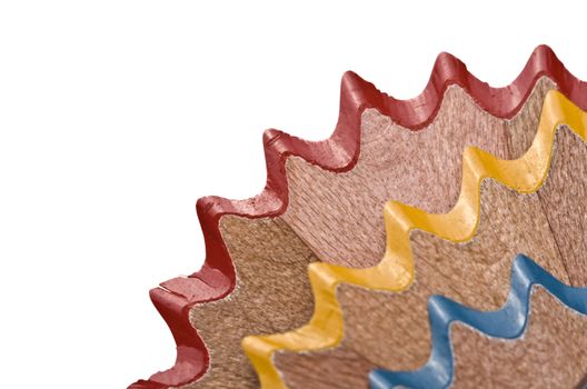 Wood remains from sharpening pencils. Blue, red and yellow, perfect for cornering your designs. Shallow DOF.