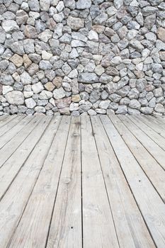 Wooden floor and stone walls background