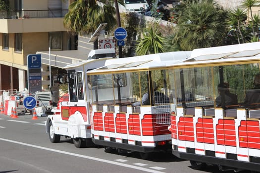 Monte-Carlo, Monaco - March 9, 2016: Red and White Trackless Train for Sightseeing in Monaco on the Street of Monte-Carlo, Monaco in the south of France