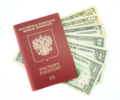 The international passport lies on dollars on a white background