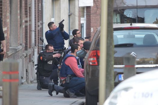 BELGIUM, Brussels: Police officers stand guard at the site of a shooting on Dries-Driesstraat at Forest-Vorst, in Brussels, on March 15, 2016. Shots were fired at Belgian police in the capital Brussels as they carried out an operation linked to the Paris attacks, Belgian prosecutors told.