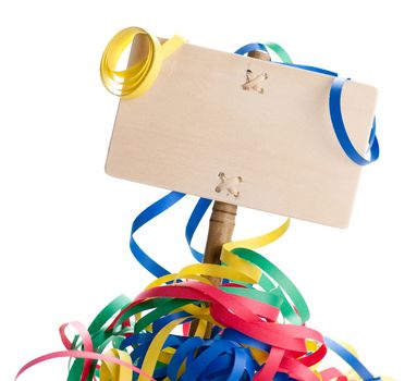 wooden sign with multicolored streamers around, white background, blank tag for writing a party message