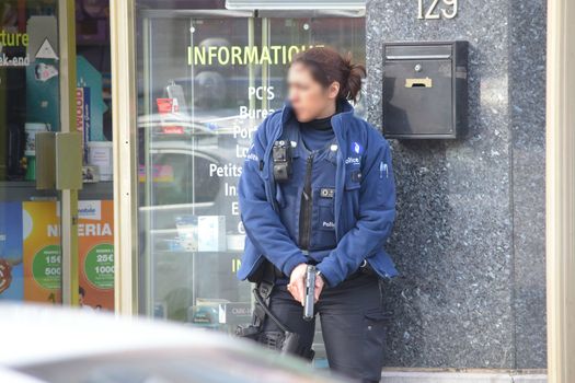BELGIUM, Brussels: A Belgian police officer stands guard at the site of a shooting on Dries-Driesstraat at Forest-Vorst, in Brussels, on March 15, 2016. Shots were fired at Belgian police in the capital Brussels as they carried out an operation linked to the Paris attacks, Belgian prosecutors told. 