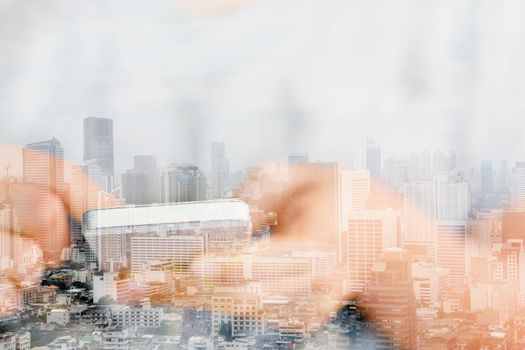 Double exposure image of people with smart phone and cityscape background,communication technology concept.