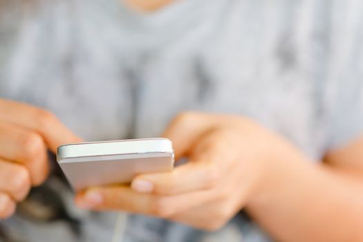 Close up of young woman using a smartphone