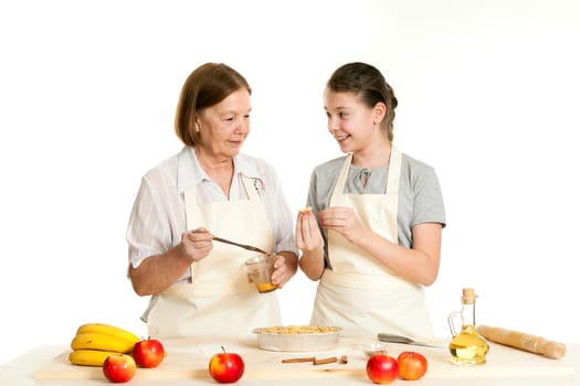 the grandmother and the granddaughter grease pie with a brush with egg