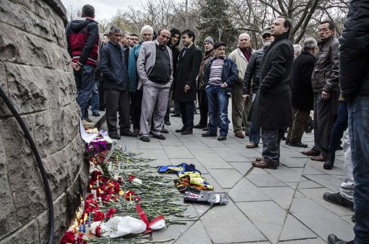 TURKEY, Ankara: People lay carnations at a makeshift memorial for the victims of Sunday's suicide bomb attack in Ankara, on March 15, 2016 in Ankara, near the site of a suicide car bombing on March 13 that left 35 dead.Turkish warplanes pounded Kurdish rebel bases in northern Iraq on March 14, the day after a suicide car bomb tore through downtown Ankara killing at least 35 people, the third attack on the capital in five months. There was no immediate claim of responsibility for the latest carnage, which reduced cars and buses to charred hulks on a busy road in the heart of the city, wounding more than 120 people. 