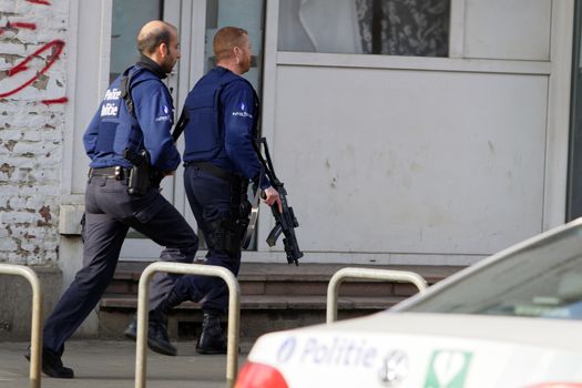 BELGIUM, Brussels: Police officers intervene at the site of a shooting on Dries-Driesstraat at Forest-Vorst, in Brussels, on March 15, 2016. Shots were fired at Belgian police in the capital Brussels as they carried out an operation linked to the Paris attacks, Belgian prosecutors told.